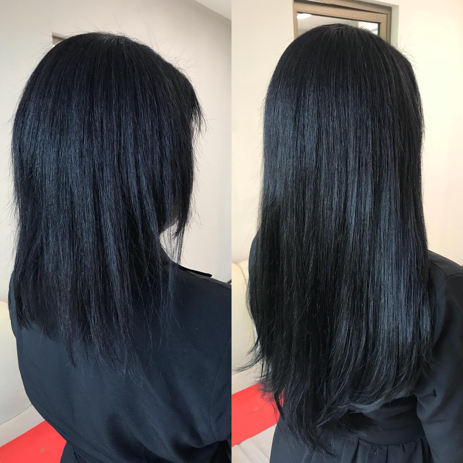 A client receiving Damage-free hair extensions Orlando - FL at a luxury salon.